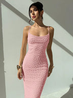 Elegant and romantic long dress for ladies with thin shoulder straps, a cinched waist and a slim figure, made of textured fabric