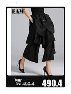 EAM 2024 New Fashion Winter Stand Collar Irregular Long Type Black Cotton-padded Clothes Loose Coat Black Jacket Woman YA771