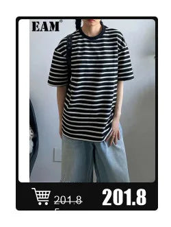 EAM 2024 New Fashion Winter Stand Collar Irregular Long Type Black Cotton-padded Clothes Loose Coat Black Jacket Woman YA771